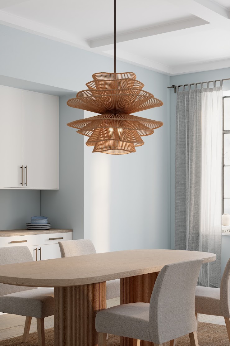 Minka Mireth woven pendant light above a dining table in a bright room with pale blue walls and soft neutral finishes.