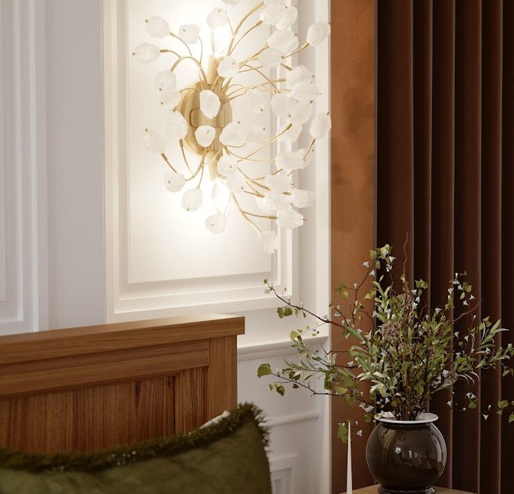 Minka Ramus wall sconce with white floral glass details above a wood nightstand in a warm, elegant bedroom setting.