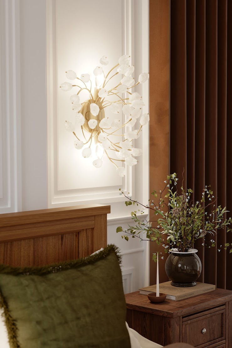 Minka Ramus wall sconce with white floral glass details above a wood nightstand in a warm, elegant bedroom setting.