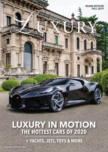 Luxury Guide Cover Fall 2019 South Florida Luxury Guide Miami Fall 2019 cover featuring a black Bugatti La Voiture Noire parked before an ornate historic mansion.