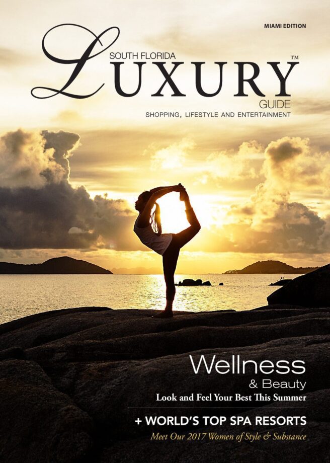 Luxury Guide Cover July-Aug 2017 South Florida Luxury Guide Miami cover featuring a silhouetted woman practicing yoga on a rocky shoreline at sunset.