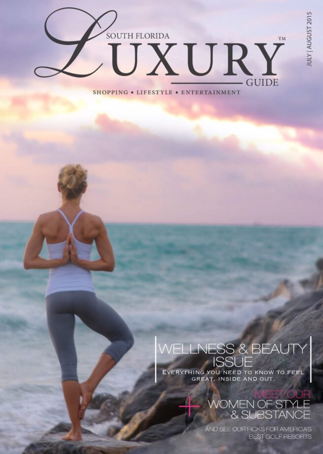 Luxury Guide Cover July-Aug South Florida Luxury Guide cover featuring a woman practicing yoga on a rocky shoreline overlooking the ocean at sunset.