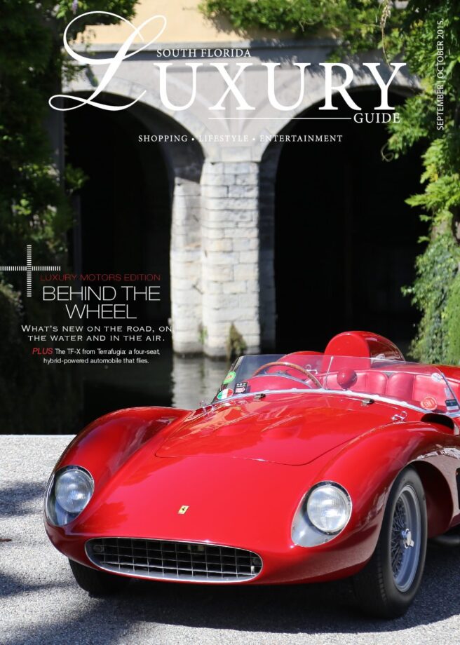 Luxury Guide Cover Sept-Oct South Florida Luxury Guide cover featuring a classic red Ferrari roadster parked near a stone bridge and lush greenery.