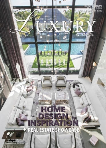 Luxury Guide Cover Spring 2019 South Florida Luxury Guide Miami Spring 2019 cover featuring a bright, double-height luxury living room overlooking a pool and landscaped courtyard.