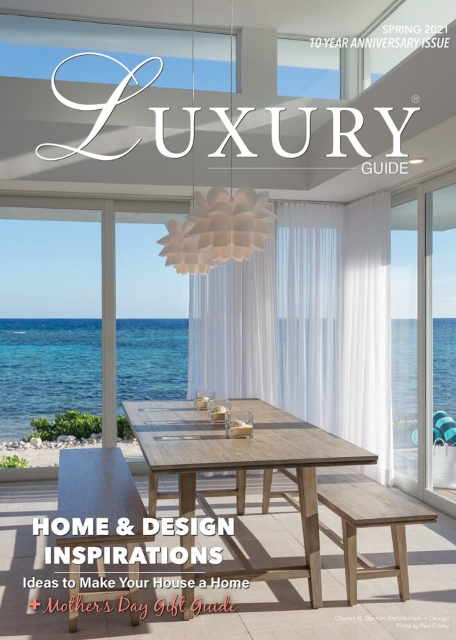 Luxury Guide Cover Spring 2021 Luxury Guide Spring 2021 10-Year Anniversary cover featuring a bright, modern oceanfront dining room with floor-to-ceiling windows and coastal views.