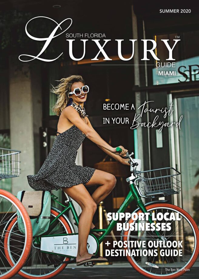 Luxury Guide Cover Summer 2020 South Florida Luxury Guide Summer 2020 cover featuring a stylish woman riding a green bicycle outside The Ben West Palm.