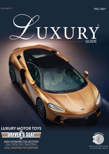 Luxury Guide Fall 2021 Luxury Guide Fall 2021 cover featuring a gold McLaren GT photographed from above against a dark studio background.